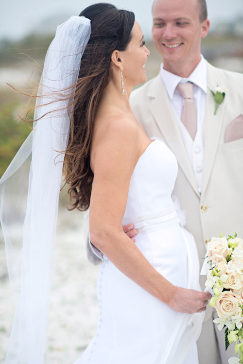 Clearwater, Florida beach wedding with a white, sand and pink wedding color palette, photo by Kristen Weaver | junebugweddings.com Clearwater, Florida beach wedding with a white, sand and pink wedding color palette, photo by Kristen Weaver | junebugweddings.com