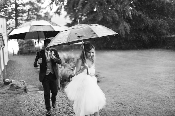 wedding portrait in the rain, photo by Sansom Photography | via junebugweddings.com wedding portrait in the rain, photo by Sansom Photography | via junebugweddings.com