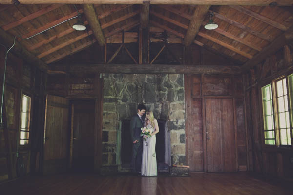 romantic camp wedding couple's portrait, photo by Terra Lange Photography | via junebugweddings.com romantic couple's portrait in a cabin with fireplace
