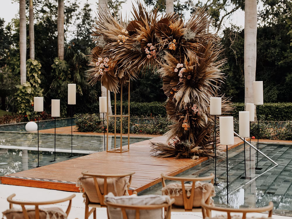 boho wedding ceremony on a pool