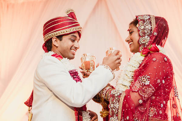 traditional Indian wedding couple sharing drinks traditional Indian wedding couple sharing drinks