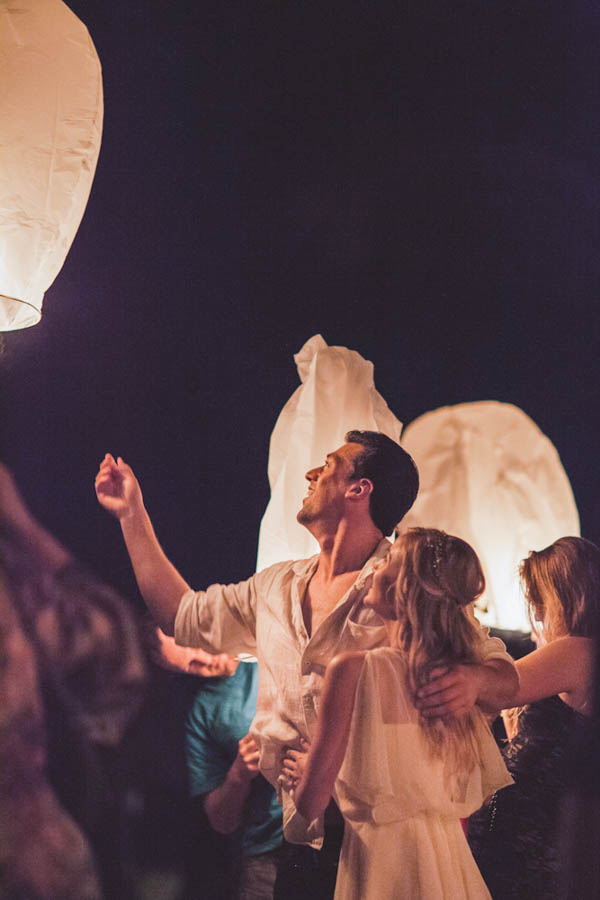 intimate beach wedding reception with floating lanterns, photo by Chris Glenn | via junebugweddings.com intimate beach wedding reception with floating lanterns, photo by Chris Glenn | via junebugweddings.com