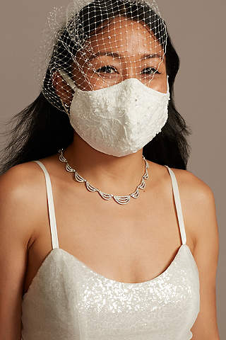 bride with veil and white lace face mask