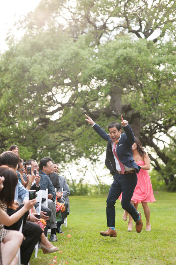 excited groom dancing down the aisle excited groom dancing down the aisle