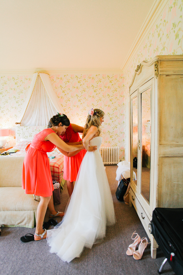 bride getting dressed, photo by Sansom Photography | via junebugweddings.com bride getting dressed, photo by Sansom Photography | via junebugweddings.com