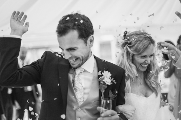 couple's confetti entrance, photo by Sansom Photography | via junebugweddings.com couple's confetti entrance, photo by Sansom Photography | via junebugweddings.com