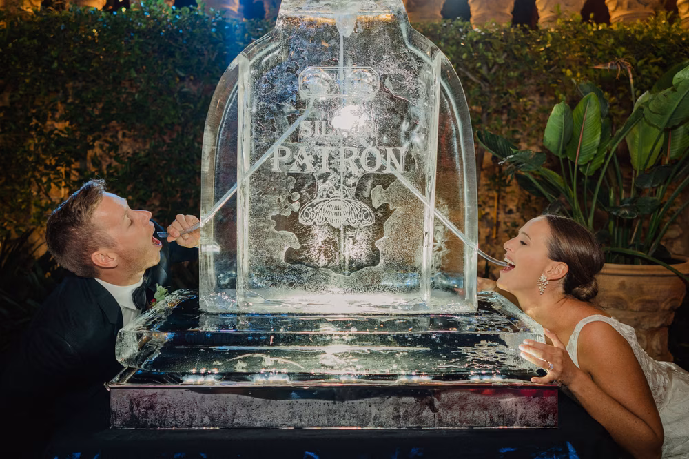couple uses ice luge at wedding