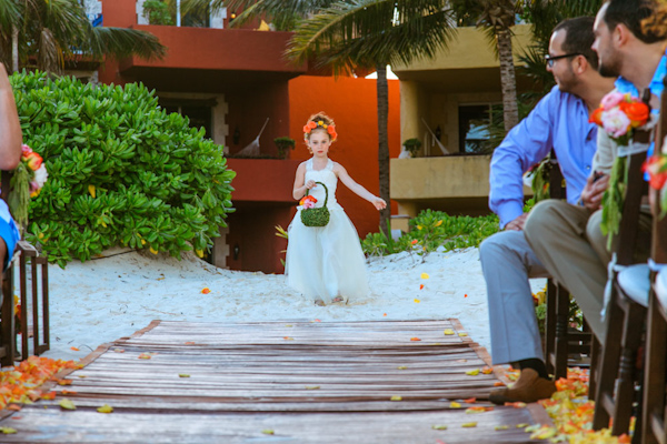 flower girl walking down the aisle, photo by Zasil Studio | via junebugweddings.com