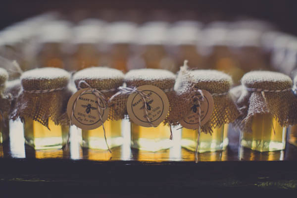romantic camp wedding honey favors, photo by Terra Lange Photography | via junebugweddings.com unique jars of honey favors