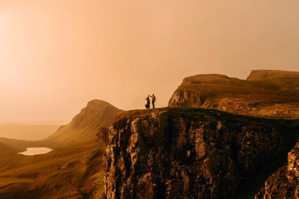 golden hour engagement photo on cliff