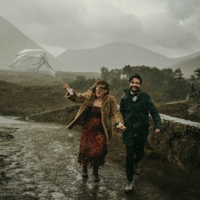 Rainy Isle of Skye engagement photo with umbrella