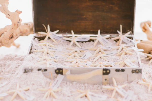 intimate beach wedding starfish decor, photo by Chris Glenn | via junebugweddings.com intimate beach wedding starfish decor, photo by Chris Glenn | via junebugweddings.com
