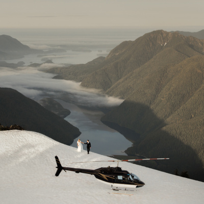 Mountain engagement photo with helicopter in Tofino, British Columbia, Canada