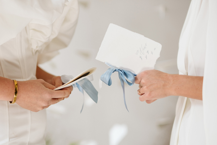 wedding vow books with blue ribbon