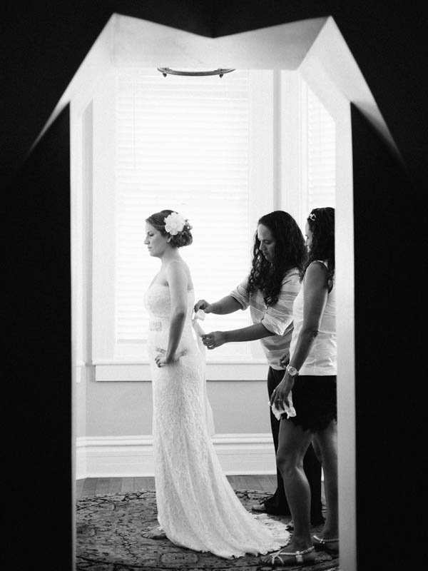 bride getting in her gown bride getting in her gown
