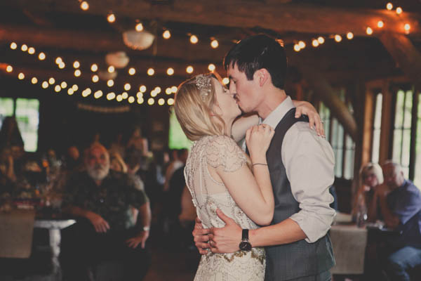 romantic camp wedding reception, photo by Terra Lange Photography | via junebugweddings.com sweet wedding reception kiss