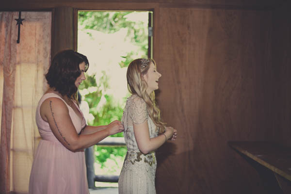 romantic camp wedding bridal portrait, photo by Terra Lange Photography | via junebugweddings.com bride getting in her wedding dress portrait