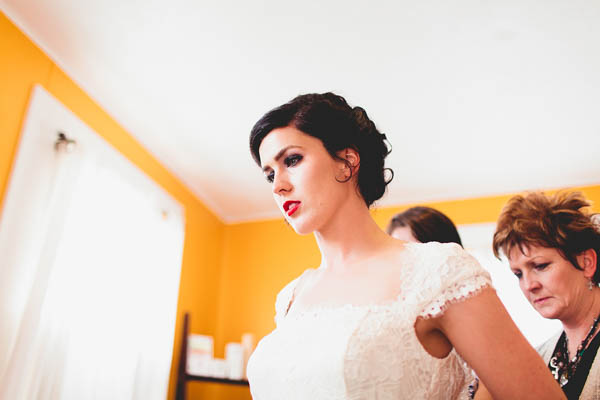 bride getting in her wedding dress bride getting in her wedding dress