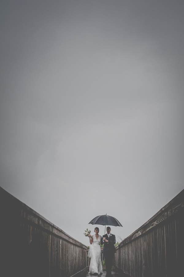 wedding portrait in the rain, photo by Still55 Photography | via junebugweddings.com wedding portrait in the rain, photo by Still55 Photography | via junebugweddings.com