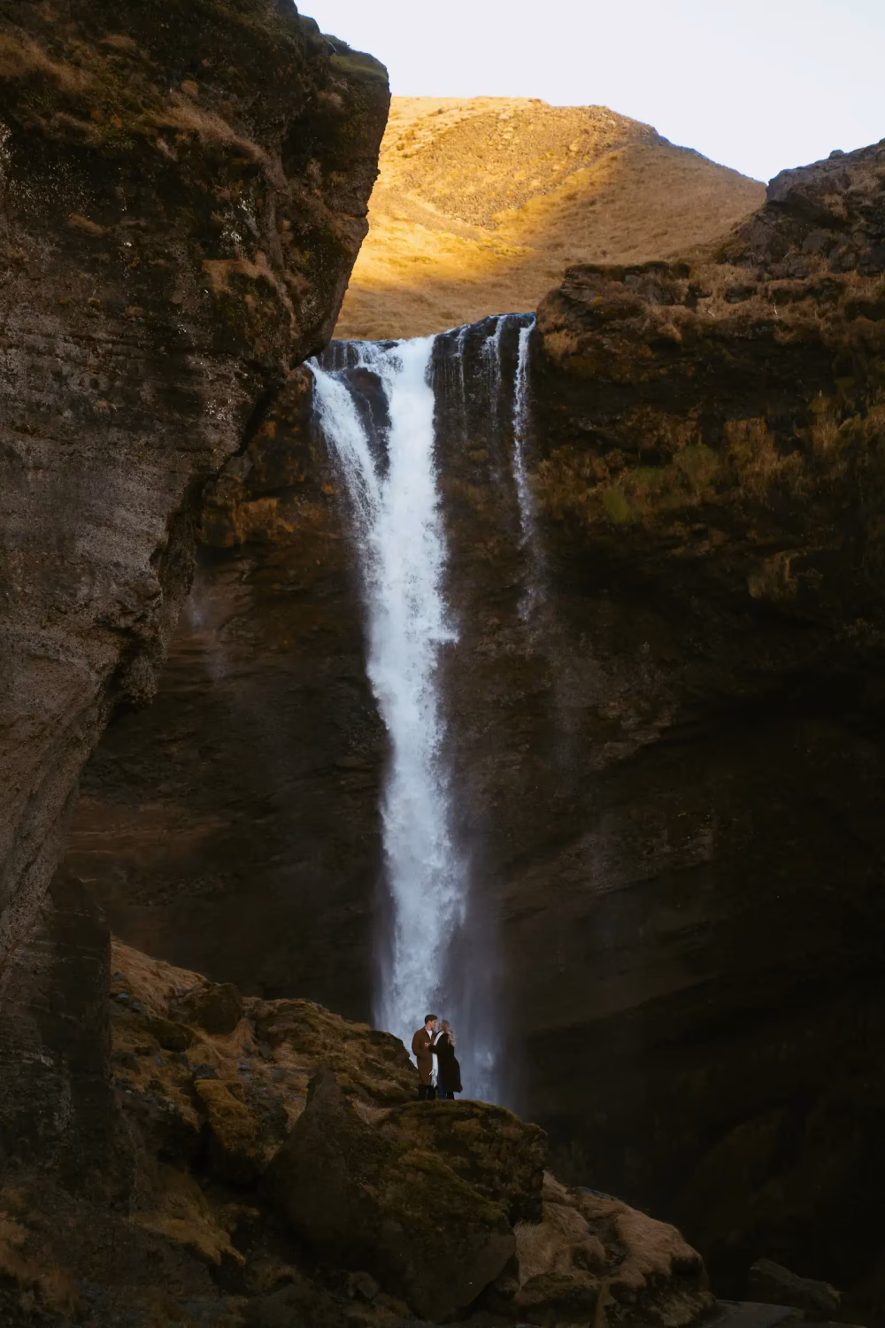 couple posing Iceland waterfall